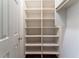 Open closet with white built-in shelving at 335 Cameron Ridge Dr, Atlanta, GA 30328