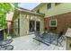 View of deck with patio furniture with access to the sunroom with brick and siding on the house at 335 Cameron Ridge Dr, Atlanta, GA 30328