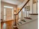 Welcoming foyer featuring a hardwood floor, classic staircase, and abundant natural light, creating a bright entry at 335 Cameron Ridge Dr, Atlanta, GA 30328