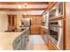 Modern kitchen featuring stainless steel appliances, center island with cooktop, and custom cabinetry at 335 Cameron Ridge Dr, Atlanta, GA 30328
