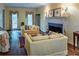 Bright living room featuring a fireplace, traditional decor, and hardwood floors, for a comfortable living space at 335 Cameron Ridge Dr, Atlanta, GA 30328