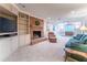 Cozy living room with a brick fireplace, built-in shelving, and comfortable seating arrangement at 335 Cameron Ridge Dr, Atlanta, GA 30328