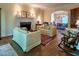 Cozy living room with a classic fireplace, comfortable seating, and archway to dining room, perfect for entertaining at 335 Cameron Ridge Dr, Atlanta, GA 30328