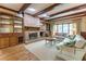 Comfortable living room with a brick fireplace, built-in shelves, and large windows at 335 Cameron Ridge Dr, Atlanta, GA 30328