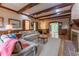Cozy living room with brick fireplace and wood beam ceiling at 335 Cameron Ridge Dr, Atlanta, GA 30328