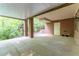 Covered brick patio offering outdoor space, privacy, and access to the surrounding landscape at 335 Cameron Ridge Dr, Atlanta, GA 30328