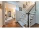 Grand foyer showcasing a staircase with wooden banister and a view into a light-filled living space, for a warm welcome at 335 Cameron Ridge Dr, Atlanta, GA 30328