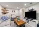Finished basement featuring wood floors, comfortable seating, and a large-screen TV at 3890 Cherrydale Se Ln, Smyrna, GA 30082