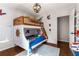 Playful bedroom featuring a bunk bed, wood floors, and themed decorations at 3890 Cherrydale Se Ln, Smyrna, GA 30082
