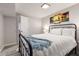 Comfortable bedroom with modern art, a double bed, and easy access to the hallway at 3890 Cherrydale Se Ln, Smyrna, GA 30082