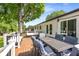 Spacious outdoor deck with dining, lounging area, and a view of the well-maintained backyard at 3890 Cherrydale Se Ln, Smyrna, GA 30082