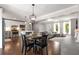 Bright open-concept kitchen, dining area, and living room with hardwood floors throughout at 3890 Cherrydale Se Ln, Smyrna, GA 30082