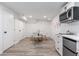 Bright kitchenette with stainless steel appliances and dining area, perfect for small meals at 3890 Cherrydale Se Ln, Smyrna, GA 30082