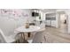 Charming kitchenette with stainless steel microwave and adjacent dining area with marble table at 3890 Cherrydale Se Ln, Smyrna, GA 30082
