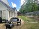 Well-manicured backyard features a stone patio, outdoor seating, and a soccer net for outdoor recreation at 4503 Woodhaven Ne, Marietta, GA 30067