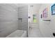 Bathroom features a tub, tiled walls, and bright natural light from the window at 4503 Woodhaven Ne, Marietta, GA 30067