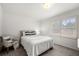Cozy bedroom featuring soft natural light, a comfortable bed, and neutral decor at 4503 Woodhaven Ne, Marietta, GA 30067