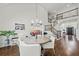 Elegant dining area features hardwood floors, chandelier, stairs to second level and access to kitchen at 4503 Woodhaven Ne, Marietta, GA 30067