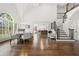 Elegant dining room showcases large windows, hardwood floors, and staircase access to the second floor at 4503 Woodhaven Ne, Marietta, GA 30067