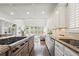 Modern kitchen with granite countertops, stainless appliances, an island with seating, and hardwood floors at 4503 Woodhaven Ne, Marietta, GA 30067