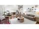 Open-concept living room showcases hardwood floors, gallery wall, and seamless flow to other living spaces at 4503 Woodhaven Ne, Marietta, GA 30067