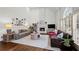 Bright living room features hardwood floors, fireplace and lots of natural light from surrounding windows at 4503 Woodhaven Ne, Marietta, GA 30067