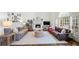 Bright living room boasts a fireplace, neutral decor, hardwood floors, and abundant natural light at 4503 Woodhaven Ne, Marietta, GA 30067