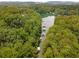 Lake view featuring boat docks surrounded by lush green trees at 5560 Pilgrim Point Ext, Cumming, GA 30041