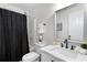 Bathroom with shower and tub combo, modern vanity, and decorative mirror at 5560 Pilgrim Point Ext, Cumming, GA 30041