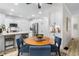 Bright kitchen with white cabinets, stainless steel appliances, and a cozy breakfast nook with seating for four at 5560 Pilgrim Point Ext, Cumming, GA 30041