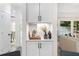 The butler's pantry has a cabinet and sliding glass doors to the living room, perfect for entertaining at 5560 Pilgrim Point Ext, Cumming, GA 30041