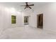 Spacious living room with vaulted ceiling, two doorways, and outdoor view at 5560 Pilgrim Point Ext, Cumming, GA 30041