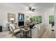 Comfortable living room with a fireplace, stylish decor, and large windows offering scenic views at 5560 Pilgrim Point Ext, Cumming, GA 30041