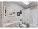 Clean bathroom with a white vanity, a toilet and a shower and tub combination at 5960 Bridge Stone Ct, Cumming, GA 30028