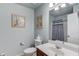 Bathroom features a single vanity, toilet, and shower/tub combo with a blue curtain at 5960 Bridge Stone Ct, Cumming, GA 30028