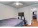 Bedroom with ceiling fan, tv, and bed at 5960 Bridge Stone Ct, Cumming, GA 30028