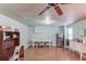 Bright dining room with white table and chairs, stainless steel refrigerator, and wood floors at 5960 Bridge Stone Ct, Cumming, GA 30028