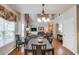 Open concept dining area with hardwood floors and large windows at 5960 Bridge Stone Ct, Cumming, GA 30028