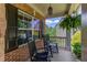 Cozy front porch with rocking chairs, ferns, and brick accents, perfect for relaxing at 5960 Bridge Stone Ct, Cumming, GA 30028