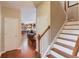 Hallway featuring hardwood floors and view into living spaces at 5960 Bridge Stone Ct, Cumming, GA 30028