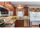 Kitchen featuring stainless steel appliances, modern countertops, and backsplash at 5960 Bridge Stone Ct, Cumming, GA 30028