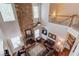 Two-story living room with stone fireplace and hardwood floors at 5960 Bridge Stone Ct, Cumming, GA 30028