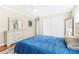 Cozy bedroom with a queen bed, hardwood floors, dresser with mirror, and closet with doors at 220 Hillswick Ct, Atlanta, GA 30328