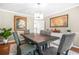 Elegant dining room with neutral walls and modern chandelier fixture, suitable for Gathering meals and gatherings at 220 Hillswick Ct, Atlanta, GA 30328