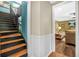 Open hallway featuring a view of the living room, hardwood floors, and staircase at 220 Hillswick Ct, Atlanta, GA 30328