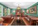 Elegant living room with two leather sofas, hardwood floors, and a stylish bar area with liquor storage at 220 Hillswick Ct, Atlanta, GA 30328