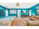 Spacious living room features a pool table, comfortable leather seating, and decor at 220 Hillswick Ct, Atlanta, GA 30328