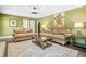Cozy living room with two sofas, an area rug, and olive green walls providing a comfortable ambiance at 220 Hillswick Ct, Atlanta, GA 30328
