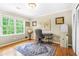 Bright office space with hardwood floors, a large window, desk, and comfortable chair at 220 Hillswick Ct, Atlanta, GA 30328
