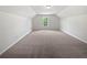 Attic bedroom features carpet, natural light from the window at 30 Trelawney Ct, Covington, GA 30016